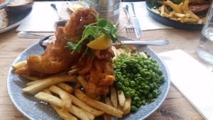 Battered banana blossom, chips, minty mushed peas and a lovely dipping sauce.. at The Lyme Bay Cafe and Bar in Lyme Regis