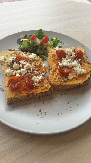 Hummus toast with cherrys and feta at ECO DEL MAR in Blanes