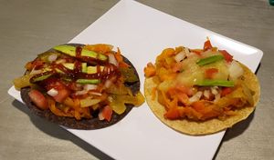 Vegan tacos with blue and yellow corn tortillas. Fresh veggies with carrot shavings and pineapples! Flavorful sauces. Red mosto was available. Friendly service and clientele.  at La Barra Del Taco in Leon