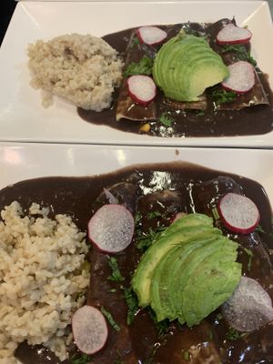 Enchiladas Oaxaqueñas with a side of brown rice   at El Colibrí Restaurant and Deli in Salinas