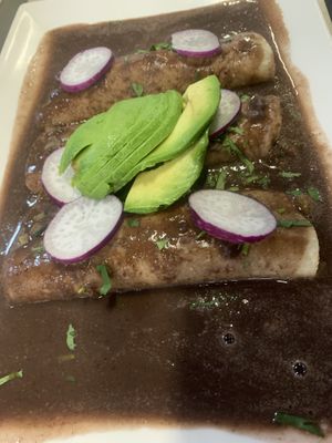 Enchiladas oaxaqueñas with radishes and avocado   at El Colibrí Restaurant and Deli in Salinas