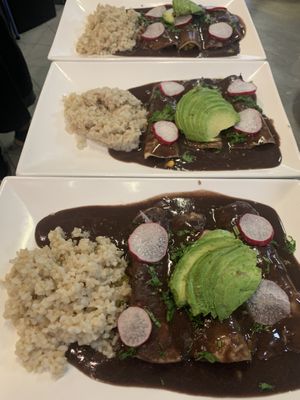 Enchiladas oaxaqueñas with a side of brown rice  at El Colibrí Restaurant and Deli in Salinas