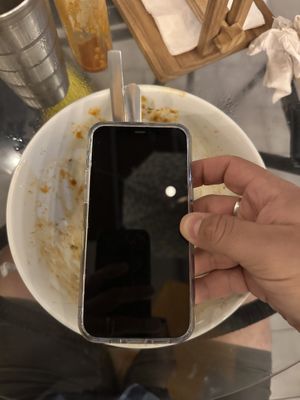 iPhone comparison of how big the bowls are  at Varuna Plant-Based Food & Juice Bar in Manuel Antonio