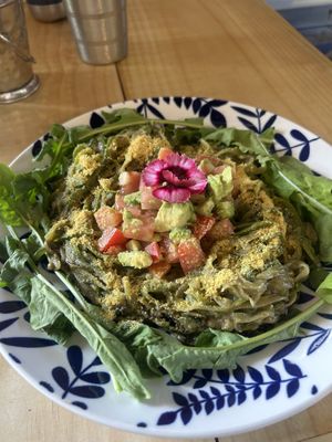 Zucchini noodle pesto with tomato and avocado (served warm) — SO good and fresh!  at Varuna Plant-Based Food & Juice Bar in Manuel Antonio