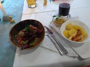 Zucchini Bratlinge, Balsamico-Zwiebel, Hummus und Kartoffeln at Restaurant Rössle in Calw