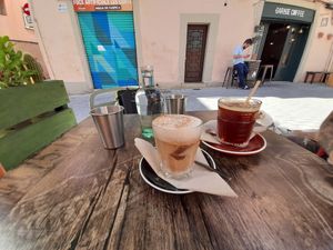 Coffee americano and cappucino with soy milk. Both on ice at Garage Coffee in Barcelona