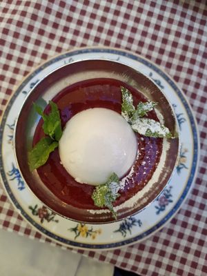 Coconut Pudding with Berry Sauce at Raparossa  in Pezze Di Greco