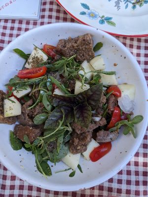 Salad with bread, tomatoes, aragula and other herbs and salads. And with a local type of cucumber typical for the region. at Raparossa  in Pezze Di Greco