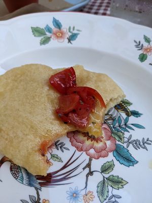 The starter: a crispy but chewy fried dough served with tomatoes and olive oil. at Raparossa  in Pezze Di Greco