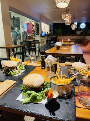 Burger and seating area  at French Cafe in Uvita