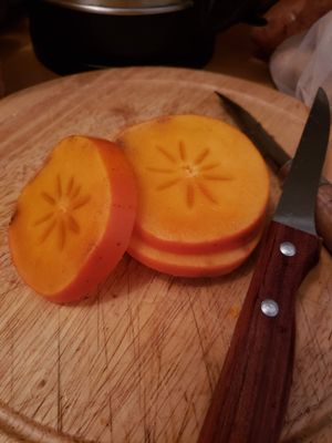 persimmon, or sharon fruit at Bio Marché in Paris