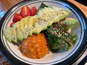 Make your own bowl. This includes a quinoa rice and salad base, avocado, tomato, cucumber and chickpea mash.  at Protein Kitchen  in Taipei