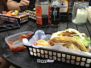 Double-decker tacos, mild salsa to the left, and Tijuana fries in the upper corner at Atacolypse in Leipzig