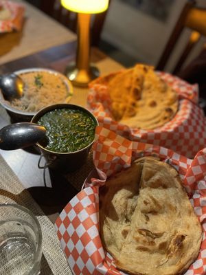 Homestyle spinach daal with cumin rice, paratha and naan   at Khau Gully in Toronto