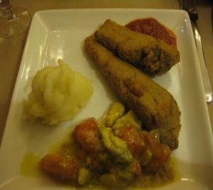 Dinner entree: Something that tasted like wheat gluten, breaded. With mashed potatoes (good) and an avocado/tomato 'salsa' was filling. at Amaltea in Barcelona
