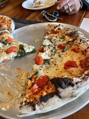Vegan cheese with cherry tomatoes and spinach   at Wood Fired Pizza in Thomas