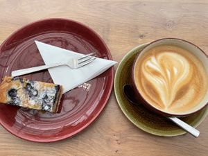 Oat milk Latte and Almond Blueberry Bakewell slice  at Rosebourne in Andover