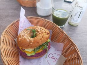 Vegan bagel and local juice at Coyote Coffee & Deli in Budapest