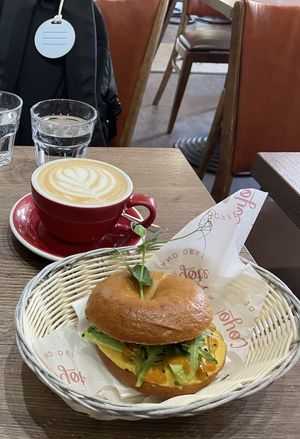 Vegan bagel and oat milk latte  at Coyote Coffee & Deli in Budapest
