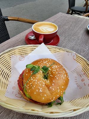 Vegan bagel and oatmilk latte at Coyote Coffee & Deli in Budapest