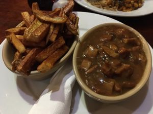 'steak' and gravy with chips  at The Globe in Glossop