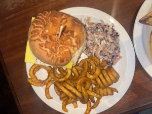 Minty lamb burger with curly fries   at The Globe in Glossop