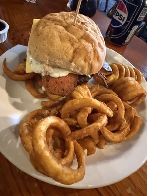 Lamb and mint burger with curly fries   at The Globe in Glossop
