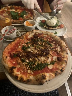 Vegan special - mushrooms, caramelised onions, organic tomato, spicy watercress pesto and roasted hazelnuts  at Franco Manca - Bermondsey in South East London