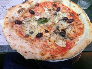 Salty olives and capers with vegan cheese at Franco Manca - Brixton in South West London