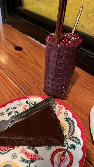 Blueberry Smoothie & Vegan chocolate orange cake   at Secret Garden Cafe in Rishikesh