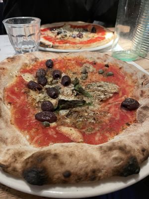 This is number five, véganised with vegan cheese and mushrooms instead of anchovy. Yum    at Franco Manca - Soho in London