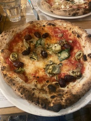 Vegan pizza (margarita base with vegan cheese + artichoke and olives)  at Franco Manca in Brighton