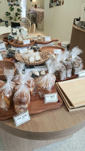 selection of baked goods - breads in foreground at Laze Oven 레이즈오븐 in Ansan
