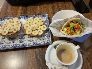 Toast with peanut butter and banana and Arepas Fresca  at Elvira 81 in Granada