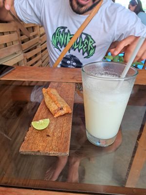 Limonada de coco y empanada vegan at Atelier in Mancora
