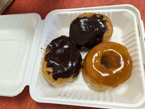 Two Boston Cream, and a Pumpkin spice glazed at Dough House Vegan Donuts in Black Mountain
