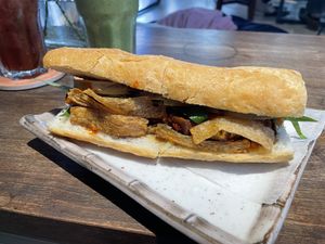 Bahn mi hoi an with French baguette. Part of the vegan bahn mi/iced tea combo for 78,000 VND (plus 10% tax).  at The Joi Factory in Ho Chi Minh City