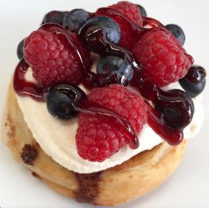 Lemon Frosting, Raspberries, Blueberries & Strawberry Jam!  at Cinnaholic in Ann Arbor