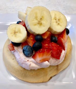 Raspberry Frosting with Bananas, Blueberries & Strawberries! at Cinnaholic in Ann Arbor