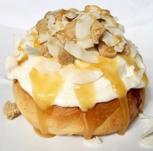 Vanilla Frosting with Cookie Pieces, Coconut & Caramel Sauce! at Cinnaholic in Ann Arbor