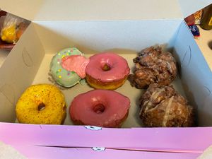 Top left: Birthday Cake (pink swirl melted in transit)
Bottom left: Mango Con Chile
Middle: Cherry Bourbon
Right: Strawberry Peanut Butter Fritter at Dough Joy - East Pike Street in Seattle