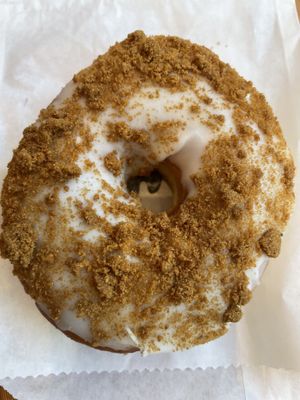 Vanilla Bischoff—vanilla cream donut with Bischoff cookie crumble  at Dough Joy - East Pike Street in Seattle