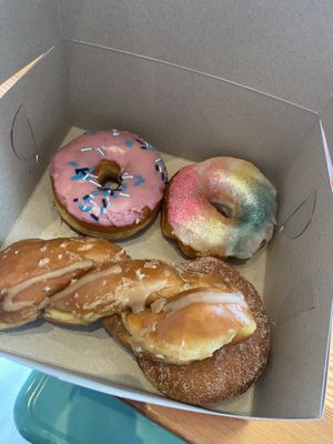 Strawberry Milkshake, Pride Donut, Glazed Sea Salt Twist, and (hidden) seasonal donutts  at Dough Joy - East Pike Street in Seattle