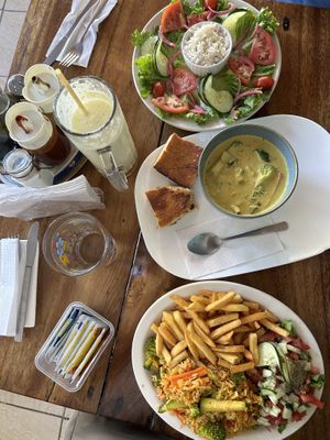 Thai curry came with a plate full of veggie and rice. And the rice with veggies.  at The Bakery Cafe in Montezuma
