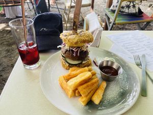 Burger with yuca fries + iced tea   at Biribá in Puerto Viejo De Talamanca