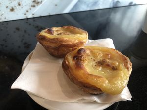 Pastel de nata sprinkled with cinnamon.   at Vegan Nata in Amadora