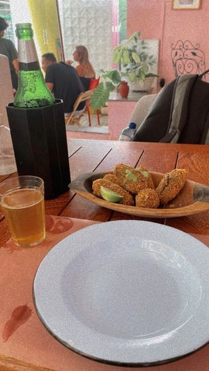 Cerveja gelada + bolinho de feijão com couve  at Casa Patuá in Fortaleza
