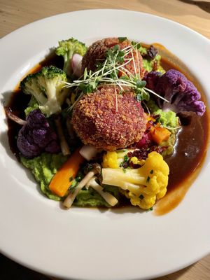 Beet dumplings with cauliflower, carrots, mushrooms, pease pudding and gravy.  at Ratskeller in Stuttgart