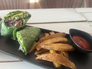 Falafel avo veggie wrap with freshly cut fries  at Seawiches Lounge Bar in Roatan