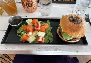 Vegan burger and side saladd  at Seawiches Lounge Bar in Roatan